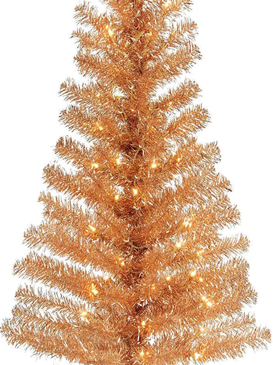 A champagne or rose-gold colored Halloween tree 