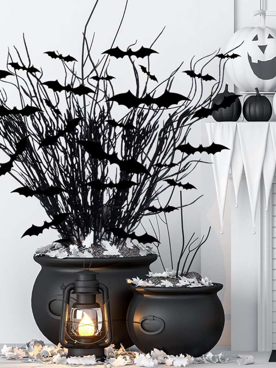 A creepy Halloween tree with its base inside a witches pot to set in the corner of a room.