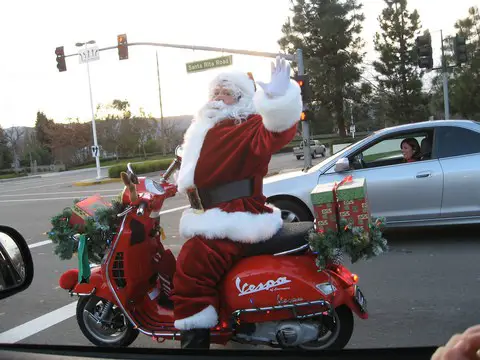 santa-on-a-scooter-delivering-presents-by-jay-galvin.jpg